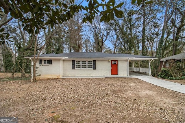 ranch-style home with a carport