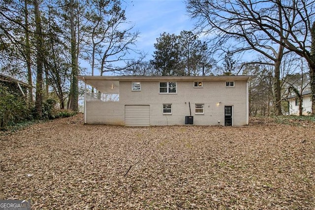 rear view of house featuring central air condition unit