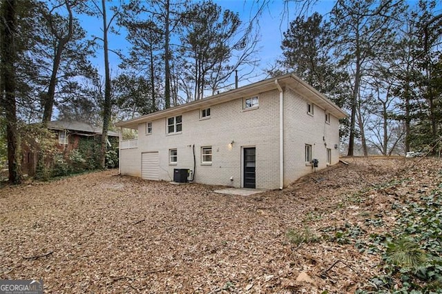 rear view of property with central air condition unit