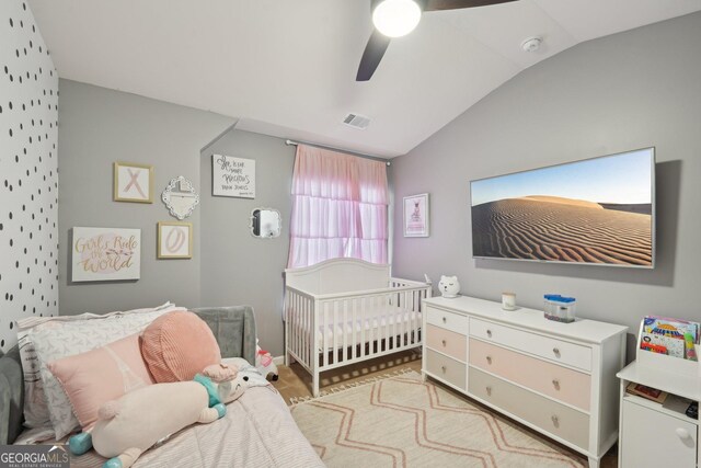 bedroom featuring vaulted ceiling and ceiling fan