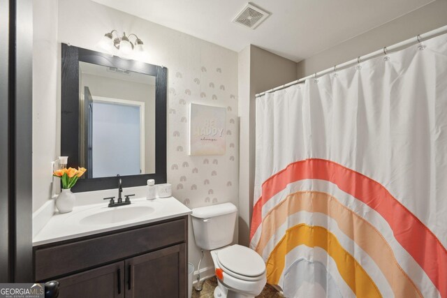 5534 Radford Loop, Fairburn, GA 30213 - bathroom with toilet, vanity, and a shower with curtain