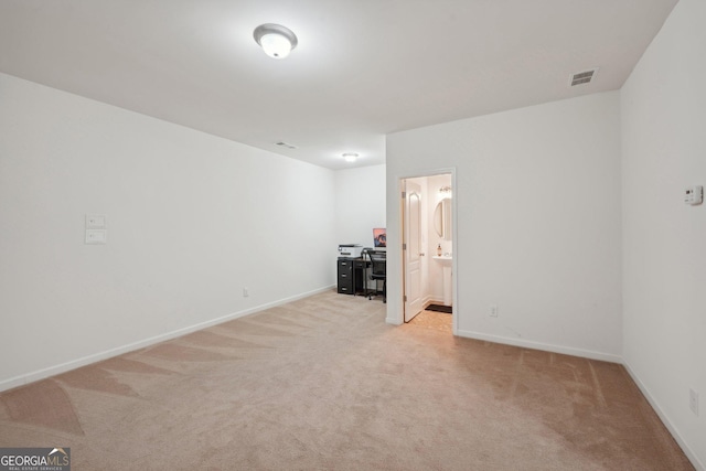 unfurnished room featuring light carpet, baseboards, and visible vents