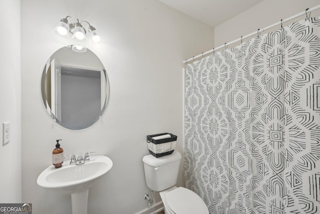 bathroom with sink and toilet