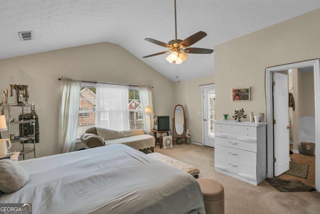 carpeted bedroom featuring multiple windows, vaulted ceiling, a textured ceiling, and ceiling fan