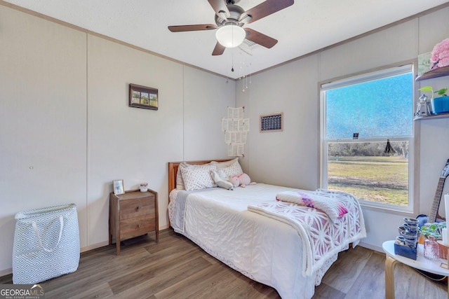 bedroom featuring ceiling fan and wood-type flooring