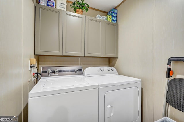 laundry area with cabinets and washing machine and dryer