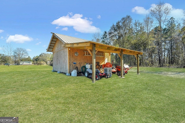 view of outbuilding with a yard