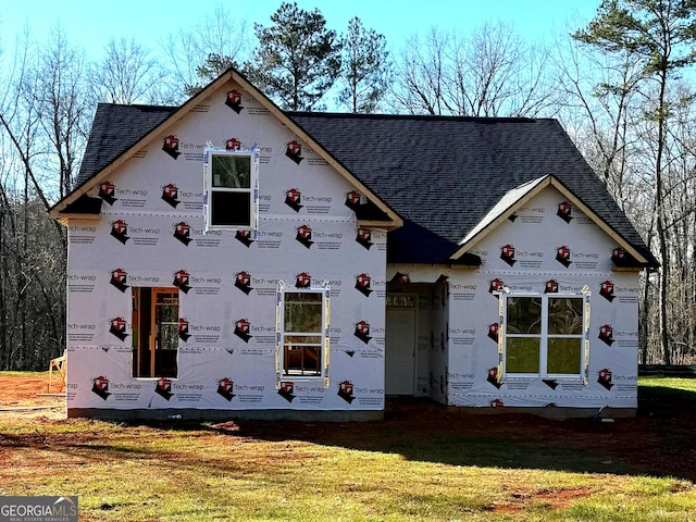 property in mid-construction featuring a front yard