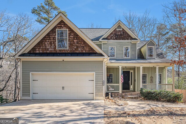 view of front of property with a garage and covered porch