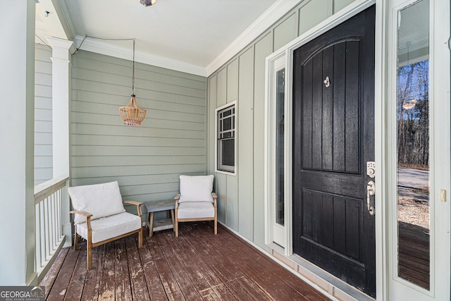 view of exterior entry with covered porch