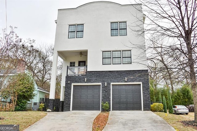 view of front of property with a garage and a balcony