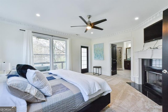 carpeted bedroom with ornamental molding and ceiling fan