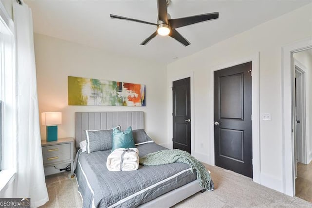 bedroom with ceiling fan and carpet floors