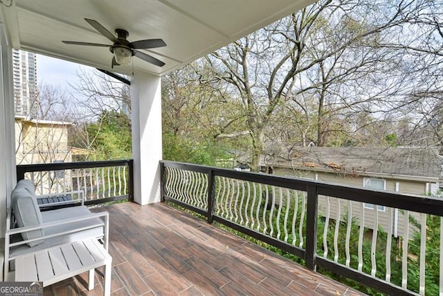 wooden deck with ceiling fan