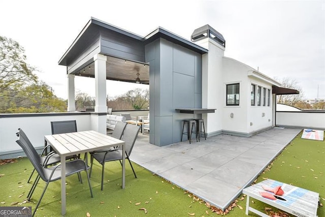 view of patio / terrace featuring exterior bar