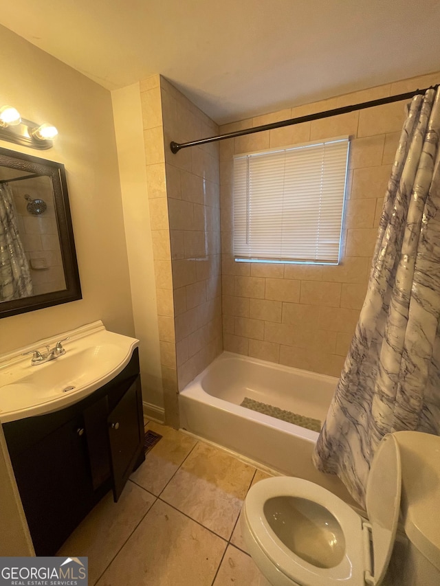 bathroom with shower / tub combo, vanity, and tile patterned flooring