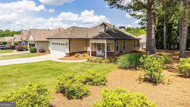 view of front facade featuring a garage, covered porch, and a front lawn