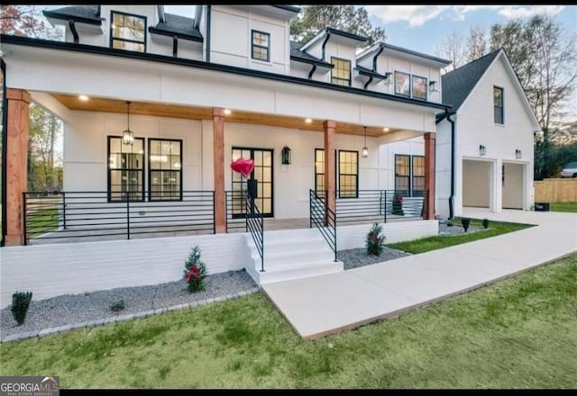 view of front of property with a garage and covered porch