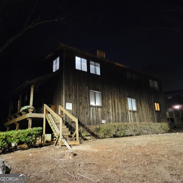 view of property exterior at night