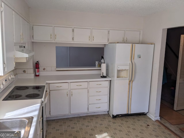 kitchen with white cabinetry, sink, a textured ceiling, and white appliances