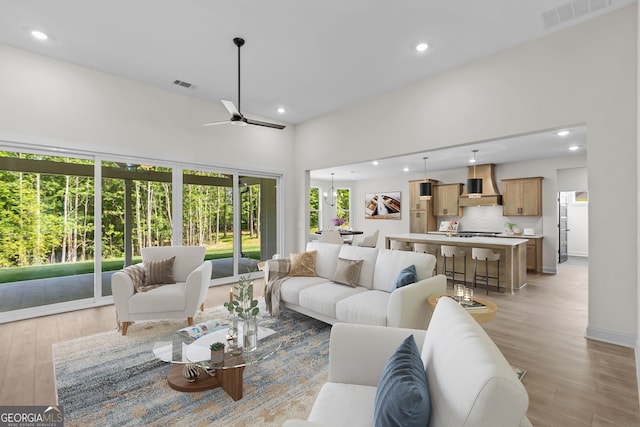 1593 Bethesda Church Rd, Carrollton, GA 30117 - living area featuring light wood-style flooring, recessed lighting, a ceiling fan, and baseboards