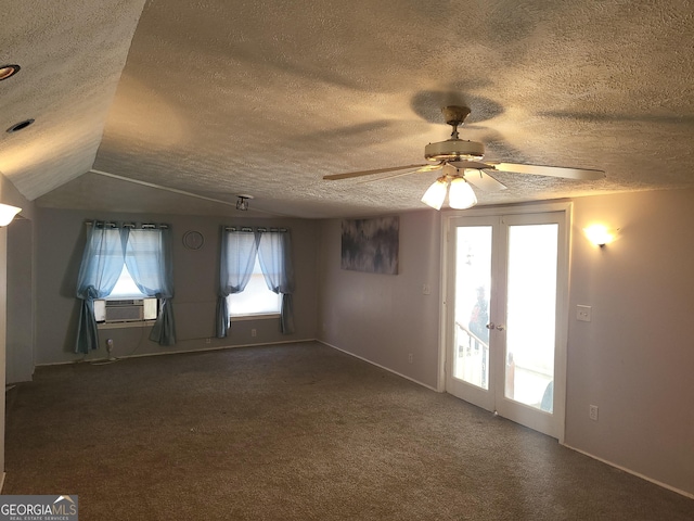 carpeted spare room featuring french doors, ceiling fan, a textured ceiling, and cooling unit