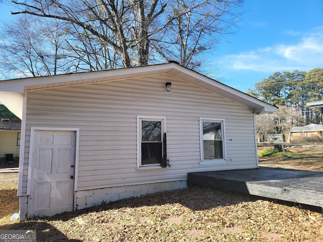 view of side of property with a deck