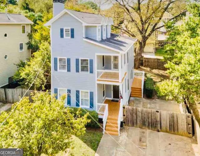 view of front of home featuring a balcony