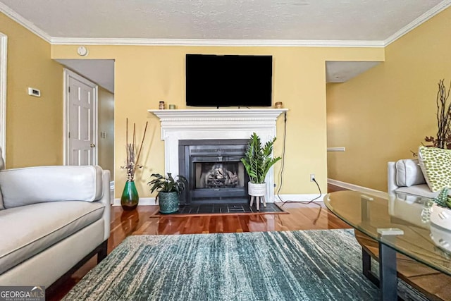 living area featuring dark hardwood / wood-style flooring, crown molding, and a textured ceiling