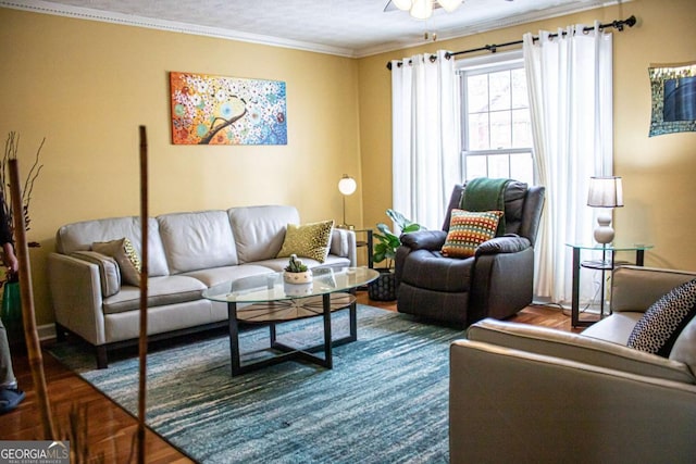 living room featuring parquet floors, crown molding, and ceiling fan