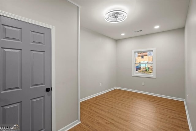 empty room with light hardwood / wood-style floors