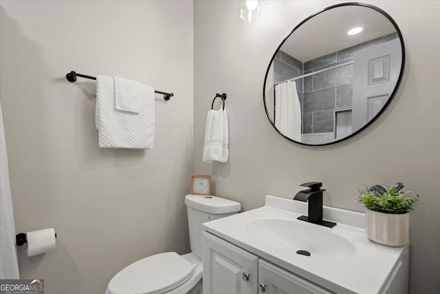 bathroom with vanity, toilet, and a shower with shower curtain