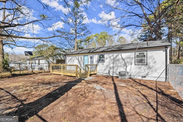 back of property featuring a deck