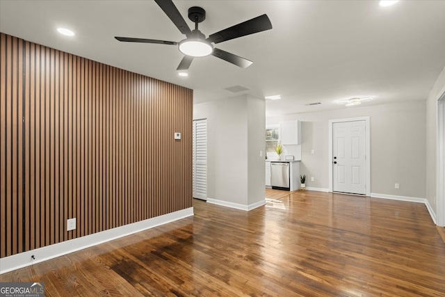 empty room with wood-type flooring and ceiling fan