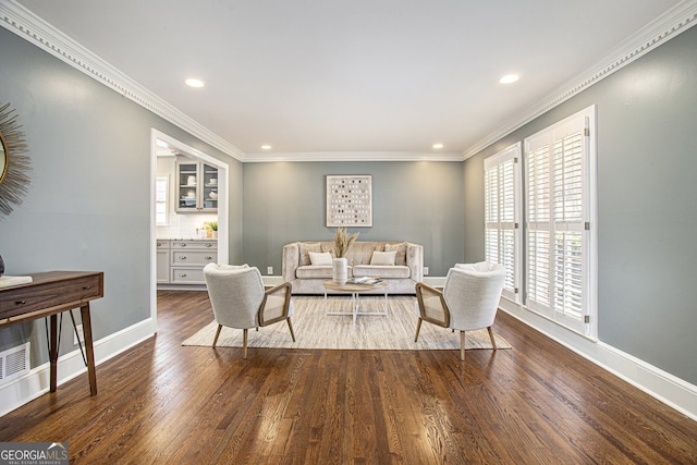 living room with dark wood-type flooring and ornamental molding