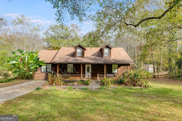 view of front of house with a porch and a front lawn