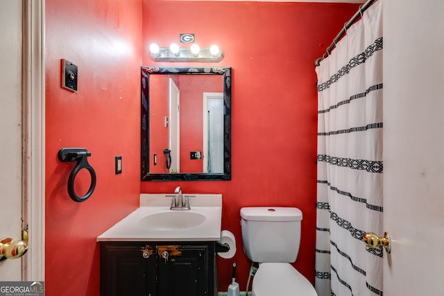 bathroom featuring vanity and toilet