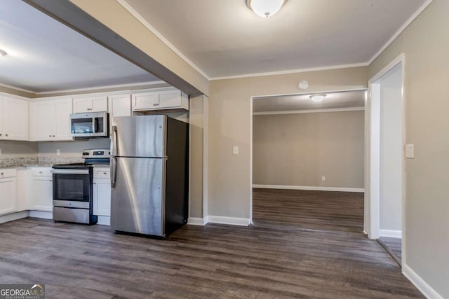 kitchen featuring crown molding, appliances with stainless steel finishes, dark wood-type flooring, and white cabinets