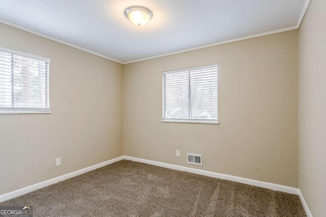 carpeted empty room with crown molding