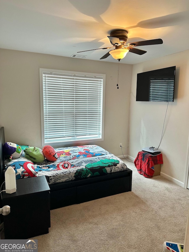 bedroom featuring ceiling fan and carpet flooring