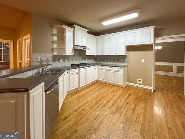 kitchen featuring white cabinetry, sink, decorative backsplash, and stainless steel appliances