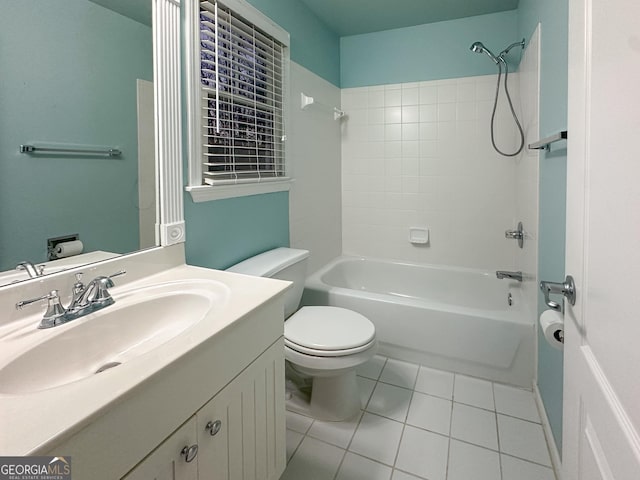 full bathroom with tile patterned floors, toilet, tiled shower / bath combo, and vanity