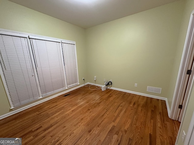 unfurnished bedroom with light wood-type flooring