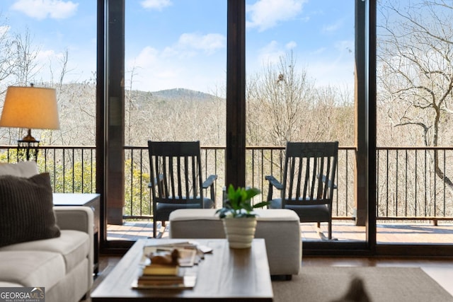 sunroom with a mountain view