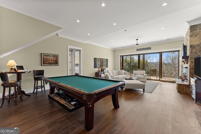 recreation room featuring hardwood / wood-style flooring, crown molding, a stone fireplace, and billiards