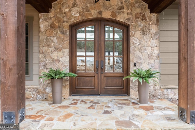 property entrance featuring french doors