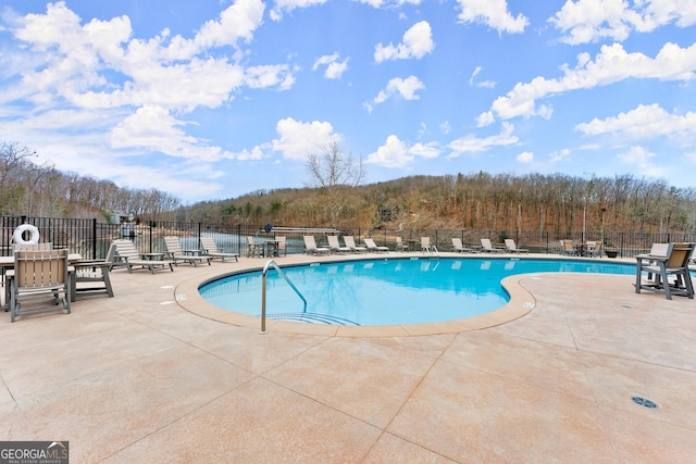 view of pool featuring a patio