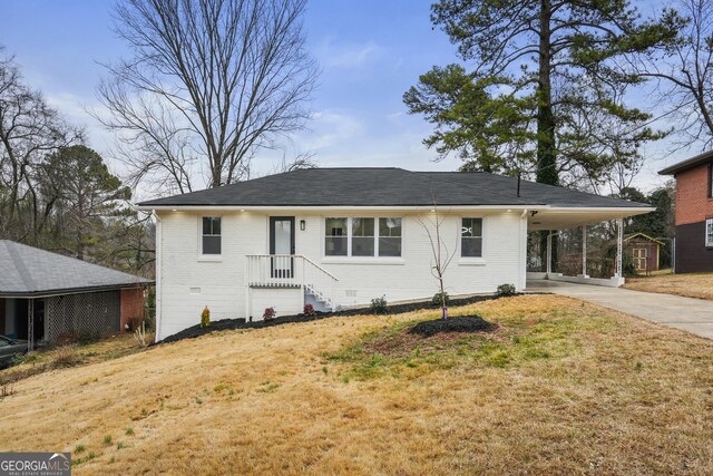 view of side of property with a carport