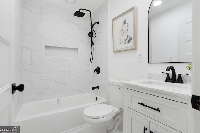 full bathroom featuring vanity, tiled shower / bath combo, and toilet