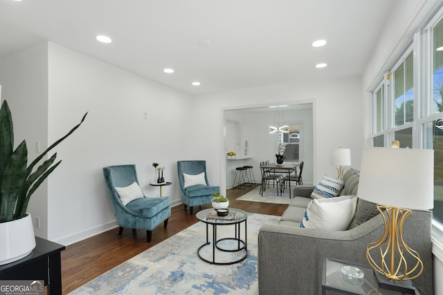 living room with dark hardwood / wood-style flooring